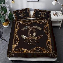 Chanel Logo Golden in Black Background Bedding Set